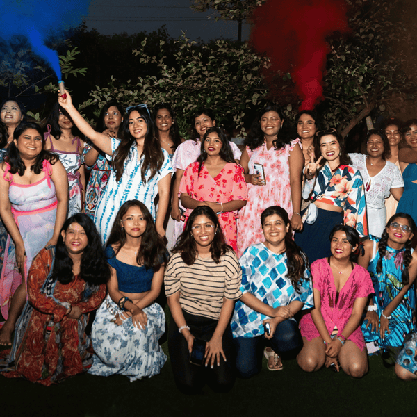 SHAPE Lingerie founder and team celebrating at an outdoor evening gathering