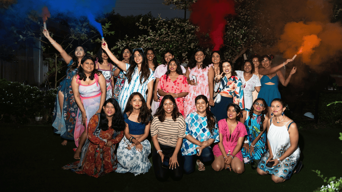 SHAPE Lingerie founder and team celebrating at an outdoor evening gathering