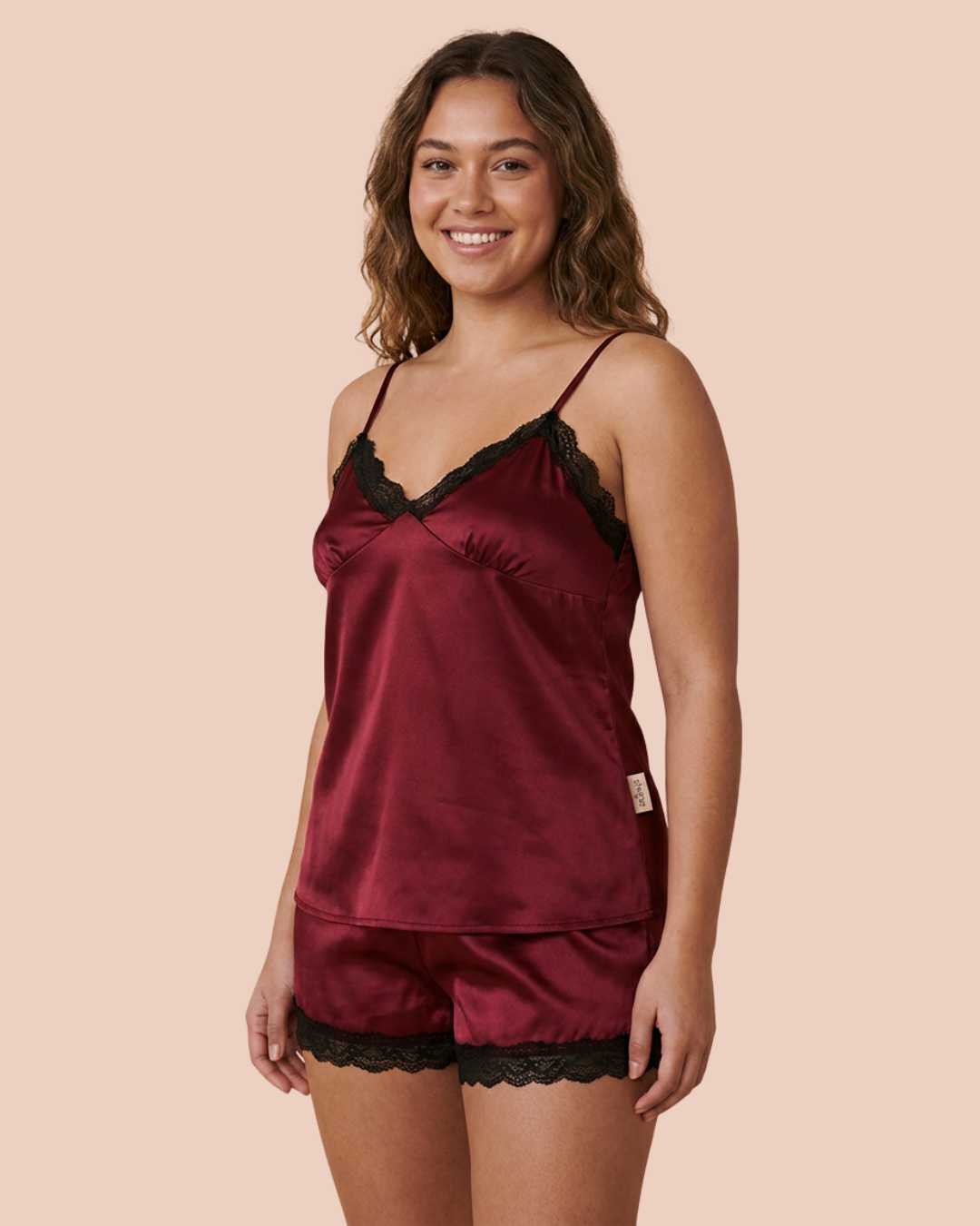 Noir four-piece bridal lingerie set, slip dress, sheer robe, camisole and shorts, in red, worn by a model, SHAPE