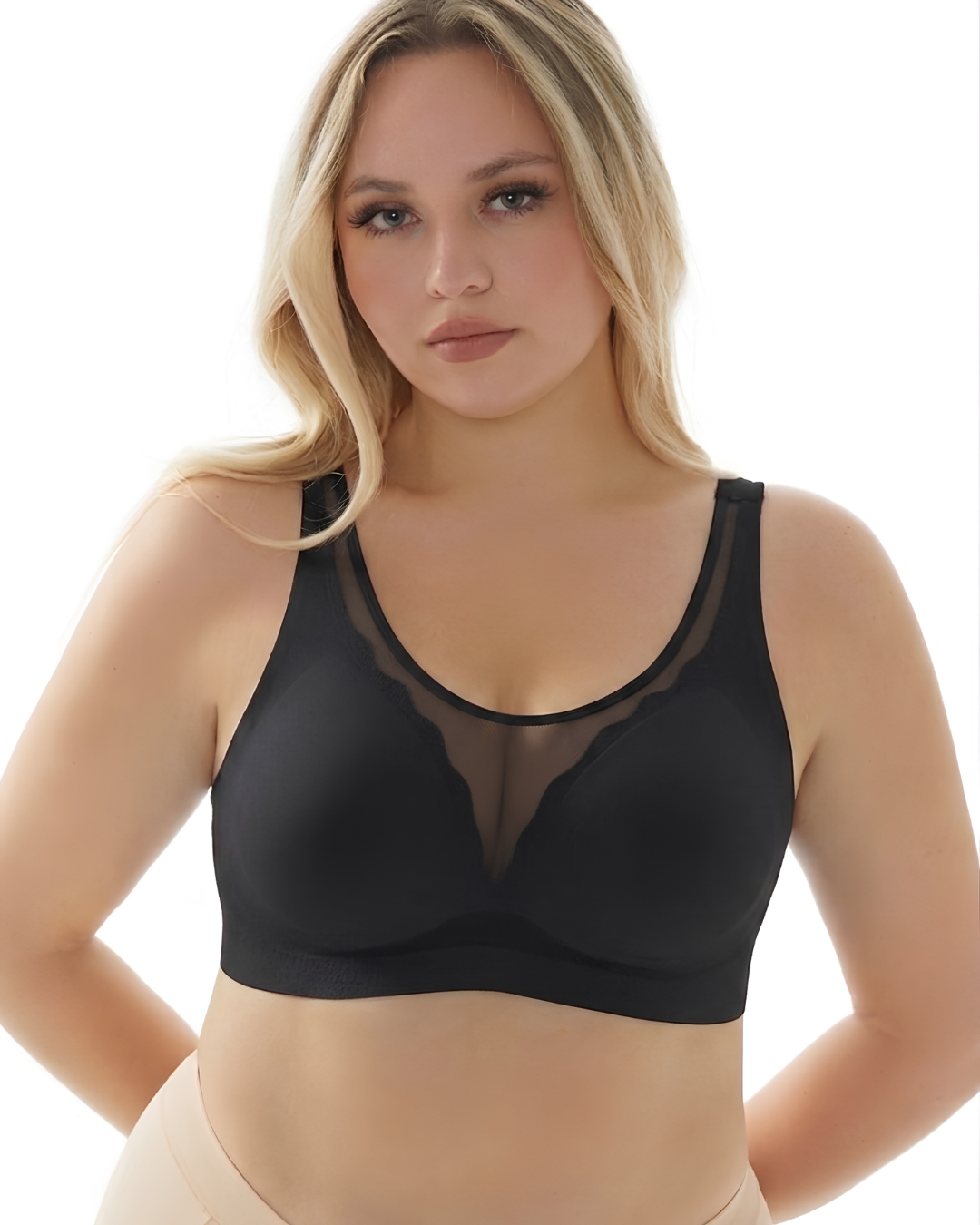 GlowCut Seamless Bra in Midnight Black worn by a model, front view, SHAPE