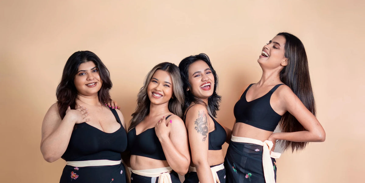 Two models wearing black SHAPE Signature Seamless Bras